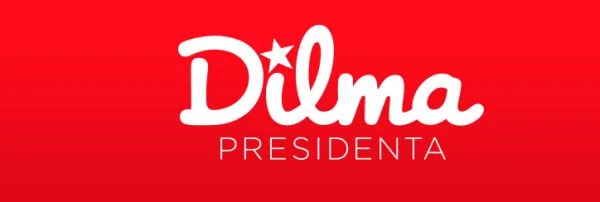 Logotipo com o nome 'Dilma' em letras brancas arredondadas com estrela vermelha sobre a letra i, e a palavra 'PRESIDENTA' abaixo sobre fundo vermelho.